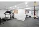 Home gym with cardio and weight training equipment, rubber flooring, and an American flag at 5441 S Dayton Ct, Greenwood Village, CO 80111
