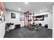 Home gym with weightlifting equipment, rubber flooring, and motivational art at 5441 S Dayton Ct, Greenwood Village, CO 80111