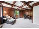 Cozy home office with coffered ceiling, wood paneling, and comfortable seating at 5441 S Dayton Ct, Greenwood Village, CO 80111