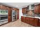 Well-equipped kitchen featuring stainless steel appliances, wooden cabinets, and modern design at 5441 S Dayton Ct, Greenwood Village, CO 80111