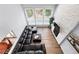 Aerial view of living room with fireplace, TV, and large windows at 5441 S Dayton Ct, Greenwood Village, CO 80111