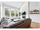 Bright living room with large windows, modern fireplace, and comfortable seating at 5441 S Dayton Ct, Greenwood Village, CO 80111