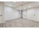 Spacious basement area showcases modern vinyl flooring, recessed lighting, and ample space at 4526 Lyndenwood Pt, Highlands Ranch, CO 80130