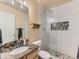 Bathroom featuring a glass-enclosed shower and modern fixtures at 301 Harvest St, Longmont, CO 80501