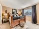 Spacious bedroom with a large window, creating a bright and airy atmosphere at 301 Harvest St, Longmont, CO 80501