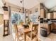 Bright dining area with sliding glass doors and a stylish chandelier at 301 Harvest St, Longmont, CO 80501