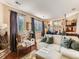 Inviting living room with large windows, hardwood floors, and comfortable seating at 301 Harvest St, Longmont, CO 80501