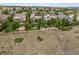 Aerial view of the backyard showing firepit, trampoline and neighborhood at 4848 Wagontrail Ct, Parker, CO 80134