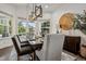 Formal dining room featuring a large table, modern lighting, and views from the large windows at 4848 Wagontrail Ct, Parker, CO 80134