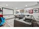 Cozy living room featuring a large screen, comfortable seating, and a stylish rug at 4848 Wagontrail Ct, Parker, CO 80134