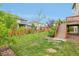 Lush backyard with well-manicured lawn, privacy fence, and convenient deck access for outdoor enjoyment at 594 Fall River Ct, Brighton, CO 80601