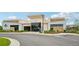 Community clubhouse boasts modern architecture with stone accents, plus mature landscaping at 594 Fall River Ct, Brighton, CO 80601