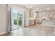 Bright kitchen features stainless steel appliances, gray cabinets, and hardwood floors at 594 Fall River Ct, Brighton, CO 80601