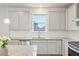 Bright kitchen features stainless appliances, granite counters, white subway tile backsplash, and abundant storage at 594 Fall River Ct, Brighton, CO 80601