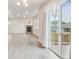 Spacious living room with a fireplace and sliding glass door that opens to a deck at 594 Fall River Ct, Brighton, CO 80601