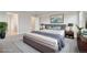 Serene primary bedroom with calming colors, soft textures, and ample natural light streaming through the windows at 594 Fall River Ct, Brighton, CO 80601