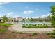 Community pool is surrounded by comfortable lounge chairs and lush landscaping, perfect for relaxation at 594 Fall River Ct, Brighton, CO 80601