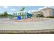 Community splash pad features water slides, sprayers, and colorful play structures for of all ages at 594 Fall River Ct, Brighton, CO 80601
