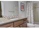 Bathroom featuring a vanity, framed mirror, and patterned shower curtain at 9441 Night Star Pl, Lone Tree, CO 80124