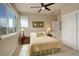 Cozy bedroom with large windows and a ceiling fan for a comfortable and relaxing space to unwind after a long day at 9441 Night Star Pl, Lone Tree, CO 80124