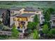 Rear exterior view of a multi-story home showcasing a patio, balcony, and fenced backyard at 9441 Night Star Pl, Lone Tree, CO 80124