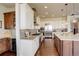Well-equipped kitchen with stainless steel appliances and a center island with bar seating at 9441 Night Star Pl, Lone Tree, CO 80124