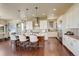 Modern kitchen with white cabinetry, a center island, and stainless steel appliances at 9441 Night Star Pl, Lone Tree, CO 80124