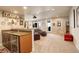 Great room with a wet bar, comfortable seating, and plenty of room to relax and entertain friends and Gathering at 9441 Night Star Pl, Lone Tree, CO 80124