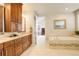 Beautiful main bathroom with double vanity, soaking tub, and ample storage at 9441 Night Star Pl, Lone Tree, CO 80124
