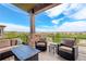 Relaxing outdoor patio with comfortable seating, a fire pit, and a beautiful view of the surrounding landscape at 9441 Night Star Pl, Lone Tree, CO 80124