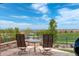 Outdoor patio boasts mountain views and a cozy seating area, perfect for relaxing and enjoying the scenery at 9441 Night Star Pl, Lone Tree, CO 80124