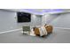 Basement seating area with cozy furnishings and entertainment space with large television at 3844 Sandy Vista Ln, Castle Rock, CO 80104