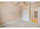 Minimalist bedroom with carpet floor, ceiling fan and closet with sliding doors at 3844 Sandy Vista Ln, Castle Rock, CO 80104