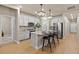 Well-equipped kitchen featuring stainless steel appliances, a kitchen island with bar stools, and ample cabinet space at 3844 Sandy Vista Ln, Castle Rock, CO 80104