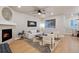 Bright living room with hardwood floors, fireplace, neutral furniture, modern decor, and ample natural light at 3844 Sandy Vista Ln, Castle Rock, CO 80104