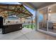 Back patio features a hot tub, pergola, and artificial turf at 3844 Sandy Vista Ln, Castle Rock, CO 80104