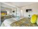 Bright bedroom with an oversized mirror, wall-mounted TV, and comfortable furnishings at 14208 E 1St Dr # C1, Aurora, CO 80011