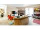 Comfortable living room with fireplace, stylish furnishings, and access to the balcony with natural light at 14208 E 1St Dr # C1, Aurora, CO 80011