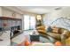 Inviting living room with stone fireplace, stylish decor, and sliding glass doors to a balcony at 14208 E 1St Dr # C1, Aurora, CO 80011