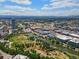 Stunning aerial view of the city with vibrant green spaces, river, and mountain backdrop at 2518 16Th St, Denver, CO 80211