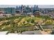 Aerial view of community with green spaces, river, and city skyline at 2518 16Th St, Denver, CO 80211