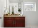 Bathroom vanity featuring a granite countertop, vanity and a window with natural light at 2518 16Th St, Denver, CO 80211