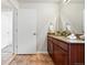 Bathroom with tiled floors, featuring a vanity with a granite countertop and ample storage at 2518 16Th St, Denver, CO 80211