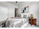 Well-lit bedroom featuring a patterned rug, modern art, and stylish side tables at 2518 16Th St, Denver, CO 80211