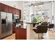 Contemporary kitchen featuring stainless steel appliances, breakfast bar, and open floor plan at 2518 16Th St, Denver, CO 80211