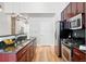 Modern kitchen with stainless steel appliances, granite countertops, and hardwood floors at 2518 16Th St, Denver, CO 80211
