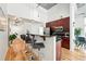 Modern kitchen with stainless steel appliances, granite countertops, and breakfast bar seating at 2518 16Th St, Denver, CO 80211