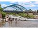 Scenic river view with people enjoying the water and a bridge in the background at 2518 16Th St, Denver, CO 80211