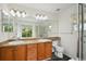 Bright bathroom features a double sink vanity and walk-in shower with natural light at 11847 Trail View Ln, Parker, CO 80134