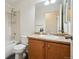 Well-lit bathroom features a shower-tub combo, a vanity, and essential fixtures at 11847 Trail View Ln, Parker, CO 80134